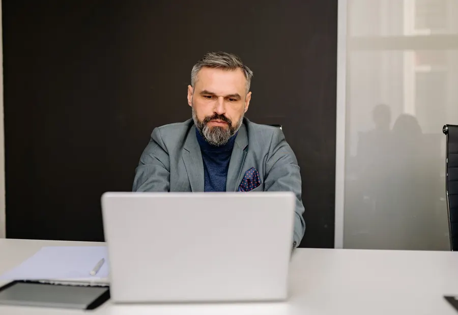 Adult working with a computer in an everyday setting